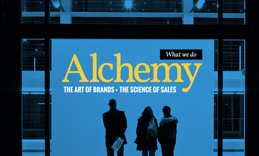people looking up at a wall with 'Alchemy The Art of Brands. The Science of Sales' written on it