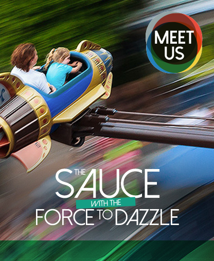 an adult and a child in a rocket ship-style fairground ride