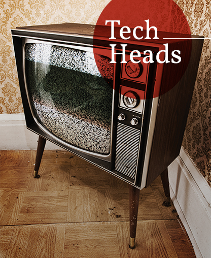 an old 1970s/1980s style tv on parquet flooring